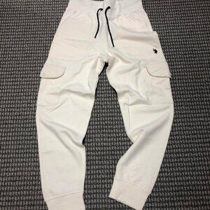 White Cream U.S. Polo Assn. joggers with black accents and a kind of cargo pants